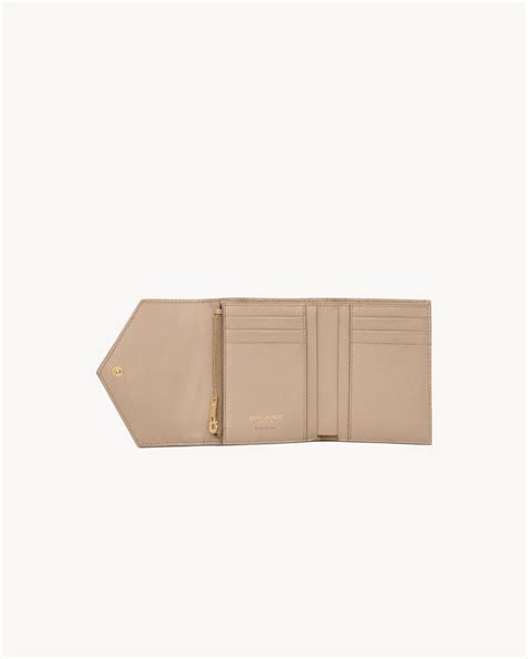 ysl tri fold|CASSANDRE MATELASSÉ compact tri fold wallet in .